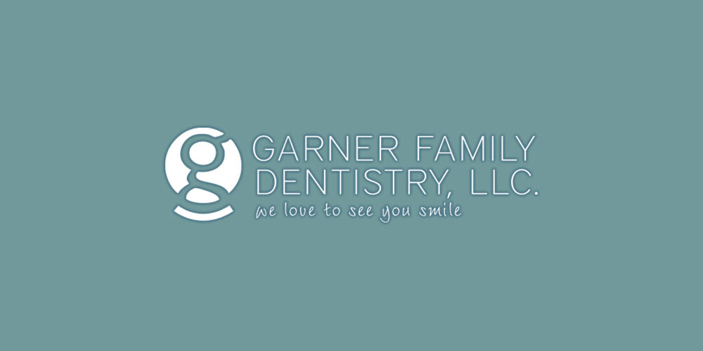 Garner Family Dentistry, LLC logo on colored background